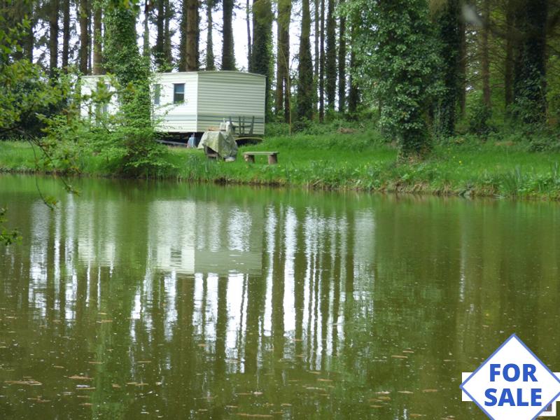 Lake With Land, Mobile Home and Woodland