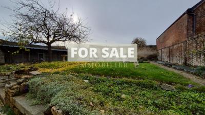 Character in Village with Garden and Garage