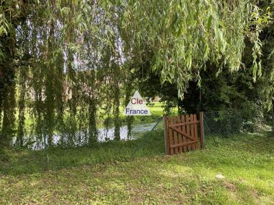 Detached House with Landscaped Garden by a River