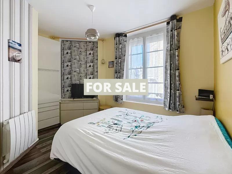 Building in Coastal Town with Rental Income