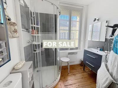 Building in Coastal Town with Rental Income