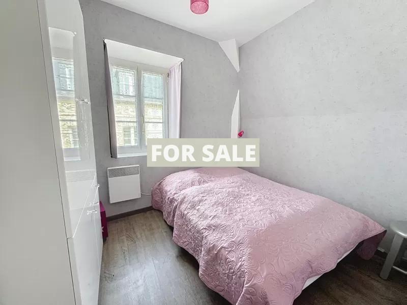 Building in Coastal Town with Rental Income