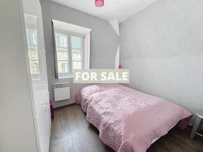 Building in Coastal Town with Rental Income