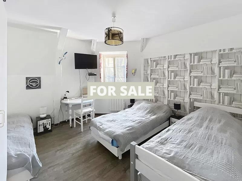 Building in Coastal Town with Rental Income