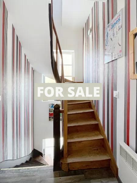 Building in Coastal Town with Rental Income