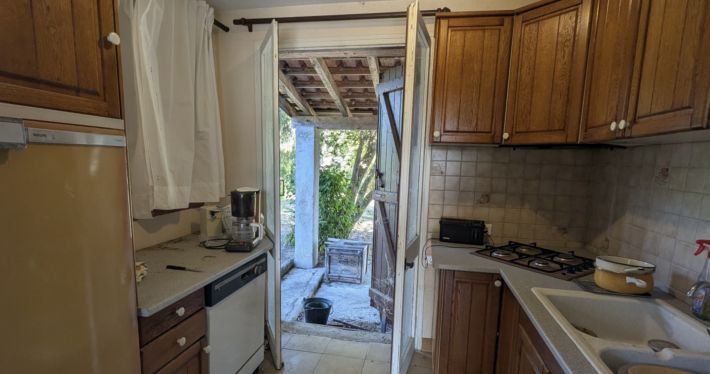 Charming and Cosy House with Bridge over Pond in Garden